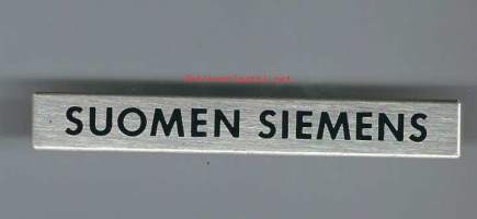 Suomen Siemens, laitemerkki - metallia 8x1 cm.