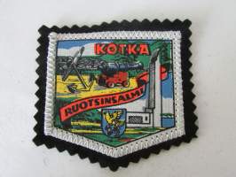 Kotka -Ruotsinsalmi -kangasmerkki / matkailumerkki / hihamerkki / badge -pohjaväri musta