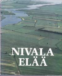 Nivala elää. 1990. 1.p. Kuva- ja tietoteos Nivalasta.
