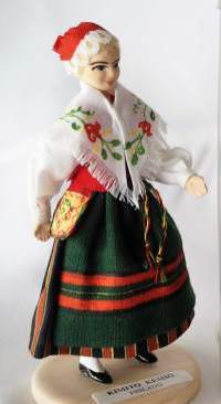 Kemiön puku -  kansallispukunukke - nukke /Käsinmaalattu ja   suomalaiseen kansallispukuun puettu 12 sm korkea nukke, joka onvalmistettu  1990-luvulla