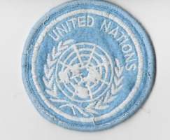 United Nations  hihamerkki.  -YK-sotilaan   hihamerkki