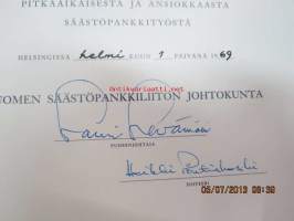 Suomen Säästöpankkiliitto / Klaus Stenroos / ansiomerkki -myöntökirja