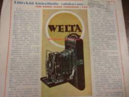 Kotiliesi 1927 / 7 Huhtikuu.Omakoti-numero.Kansik,Vieraita odotetaan.Carolu Lindberg;Maalainen rakennustyylioikeuksiinsa.Ryijysohva,Hanna-Liisa