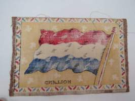 Sikarilippu Holland (Cigarr flag) -sikarilaatikossa kylkiäisenä tullut keräilyliina, ollut laatikon pohjalla sikarien alla, arviolta 1920-30 lukujen vaihteesta