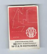 STM:n Karjalan piirin XXX laulu- ja soittojuhlat 16-17.6.79   Kotkassa  -   rintamerkki pahvia