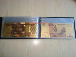 Venäjä 5-5 000 Ruplaa monivärikullatut näköissetelit omassa maa-albumissa, 7 erilaista ja hienoa seteliä. Esim. lahjaksi numismaatikolle.