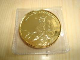 Kullanhuuhtoja, 24k kullattu 1 unssi (1 av oz = 28,35 g) puhdasta .999 kuparia. Made in USA. Kultakuume, kullankaivaja, kullanhuuhdonta. Halkaisija noin 38 mm.