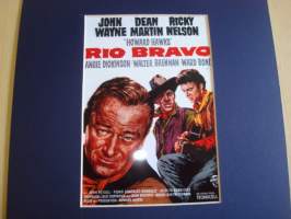 Rio Bravo taulu jossa kuva Rio Bravo elokuvasta ja alkuperäinen John Wayne postimerkki, hieno, taulun koko noin 20 cm x 25 cm. Hieno esim. lahjaksi. Tilauksesta