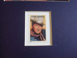Rio Bravo taulu jossa kuva Rio Bravo elokuvasta ja alkuperäinen John Wayne postimerkki, hieno, taulun koko noin 20 cm x 25 cm. Hieno esim. lahjaksi. Tilauksesta