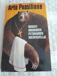 Arto Paasilinna: Rovasti  Huuskosen petomainen miespalvelija. P.1996. Suuri  suomalainen kirjakerho