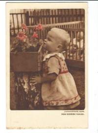 Joulumerkkikodin lapsia / Pieni kukkien vaalija postikortti ,  kulkematon - myydään lapsuusajan tuberkuloosin vastustamistyön hyväksi