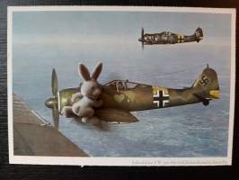 Saksalaisia Focke-Wulf 190-tyyppisiä hävittäjälentokoneita lennolla -postikortti. TK-valokuvaaja C. Berger. Reproduktion und offsetdruck Carl Werner Reichenbach i.V.