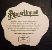 Pilsner Urquell -olut lasin alunen, Plzenský Prazdroj.