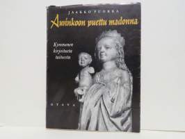 Aurinkoon puettu madonna