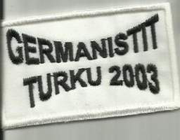 Germanistit -   hihamerkki