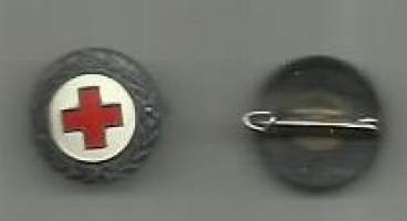 Ungdomens Röda Kors URK -   rintamerkki