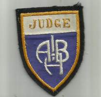 Judge - hihamerkki, matkailumerkki  kangasmerkki