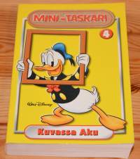 Mini-taskari 4	Kuvassa Aku