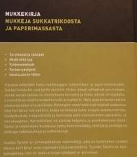 Nukkekirja- nukkeja sukkatrikoosta ja paperimassasta