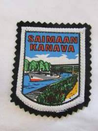 Saimaan kanava -kangasmerkki / matkailumerkki / hihamerkki / badge -pohjaväri musta