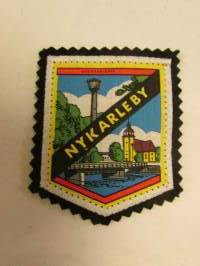 Nykarleby -kangasmerkki / matkailumerkki / hihamerkki / badge -pohjaväri musta