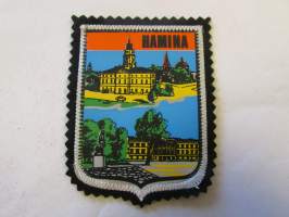 Hamina -kangasmerkki / matkailumerkki / hihamerkki / badge -pohjaväri musta