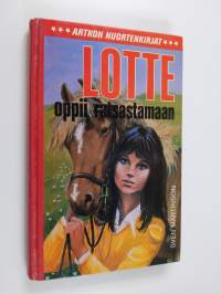 Lotte oppii ratsastamaan