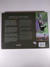 Luontokuvaajan vuosi : tarinoita ja tunnelmia = A wildlife photographer&#039;s year : a personal account