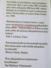 Ohukainen ja Paksukainen lahjakirja  päin seiniä