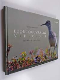 Luontokuvaajan vuosi : tarinoita ja tunnelmia = A wildlife photographer&#039;s year : a personal account