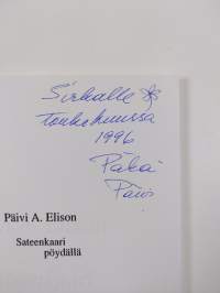 Sateenkaari pöydällä (signeerattu, tekijän omiste)