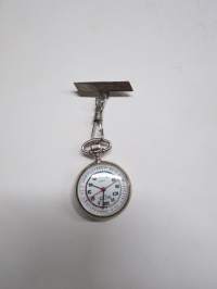 Sairaanhoitajakello &quot;Regal Quartz&quot;, kaiverrus &quot;Jenni&quot; -sairaanhoitajan rintapieleen tarkoitettu kello