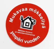 Mökkeilyä   - tarra   7 cm