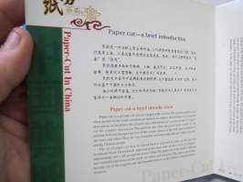 Paper Cut in China - Facial Makeup of Peking Opera -silkkipeperista leikattuja oopperanaamioita, kirjasa mukana aidot silkkipaperiset mallit