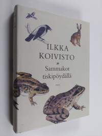 Sammakot tiskipöydällä