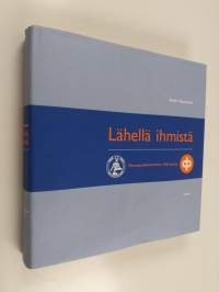 Lähellä ihmistä : osuuspankkitoiminta 100 vuotta