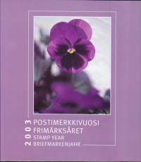 Postimerkkivuosi 2003 - Nelikielinen upea esittelyteos Suomen postimerkeistä 2003. Kaikki julkaistut postimerkit mukana POSTITUOREINA **.