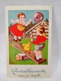 pääsiäiskortti Tyttö, tipu ja poika pallon kanssa keinumassa
