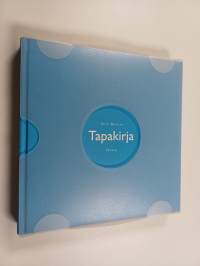Tapakirja muovikotelossa