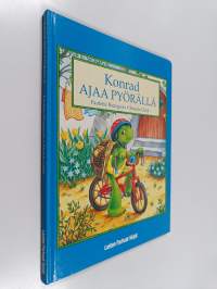 Konrad ajaa pyörällä