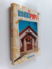 Rokkipappi : krusifiksin juurella