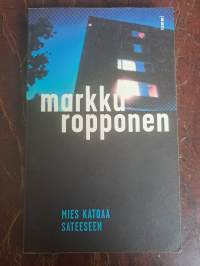 Mies katoaa sateeseen