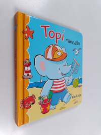 Topi rannalla