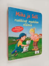 Miika ja Salli ruokkivat maatalon eläimiä