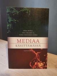 Mediaa käsittämässä