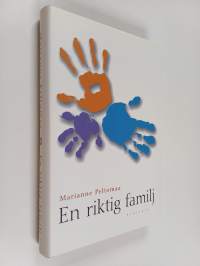 En riktig familj (signeerattu)