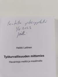 Työturvallisuuden mittamies (tekijän omiste, signeerattu)