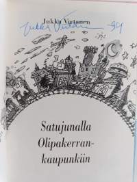 Satujunalla Olipakerran-kaupunkiin (signeerattu)
