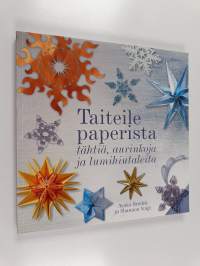 Taiteile paperista tähtiä, aurinkoja ja lumihiutaleita
