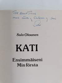 Kati : ensimmäiseni = min första (signeerattu, tekijän omiste)